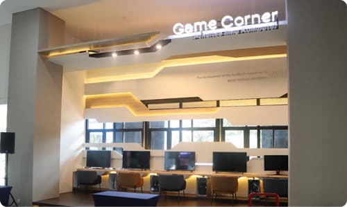 Filkom Game Corner interior showing gaming consoles